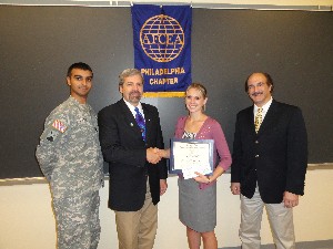 In September, Shannon Fusina, an aspiring science teacher, receives a $5,000 science, technology, engineering and mathematics scholarship from members of the chapter's executive committee: Capt. Robin Islam (l), Tom Rachfalsk (2nd from l) and Frank Arlotta.